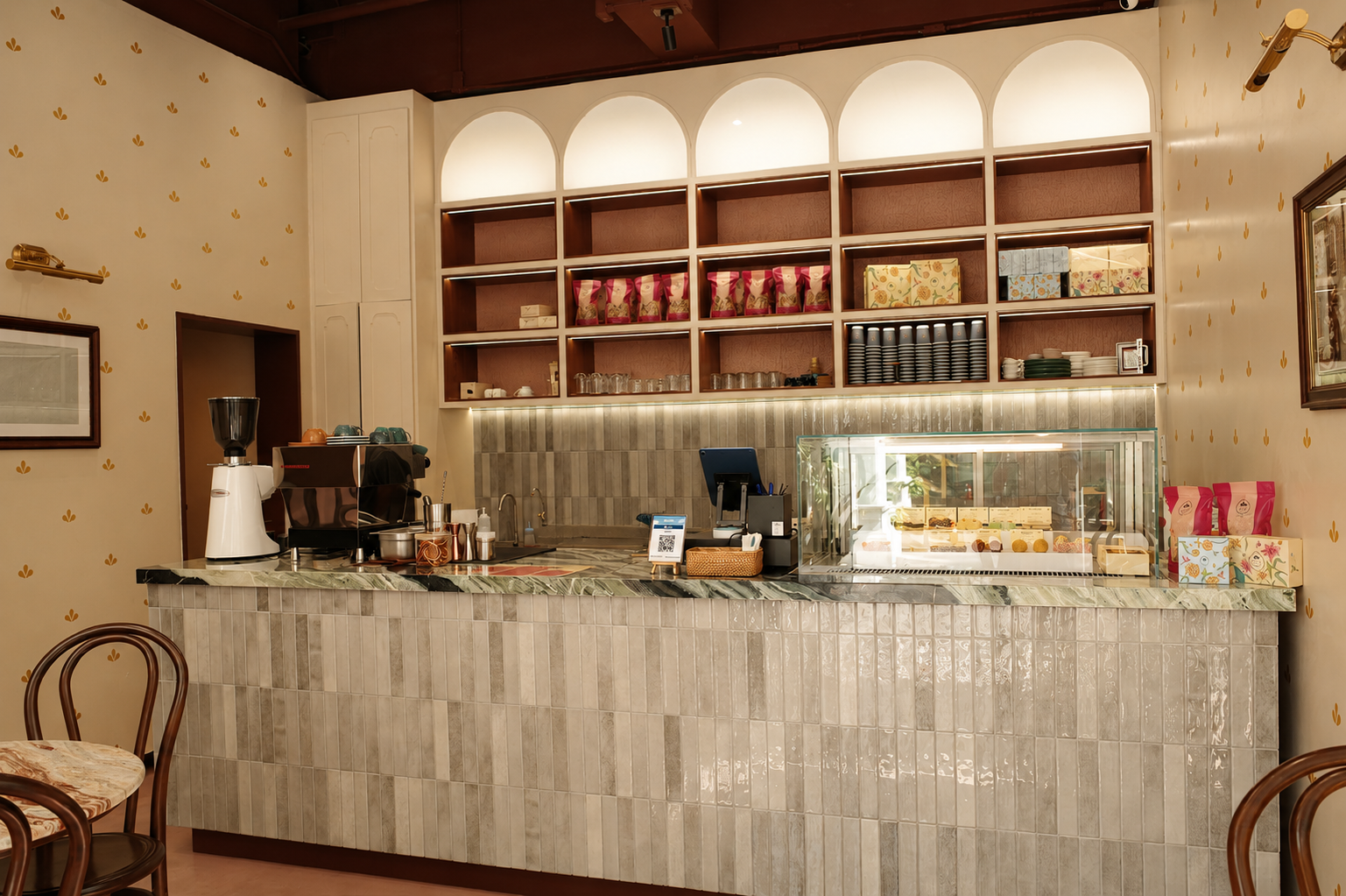 The Royals Café counter with sweets, coffee service, and gifting boxes
